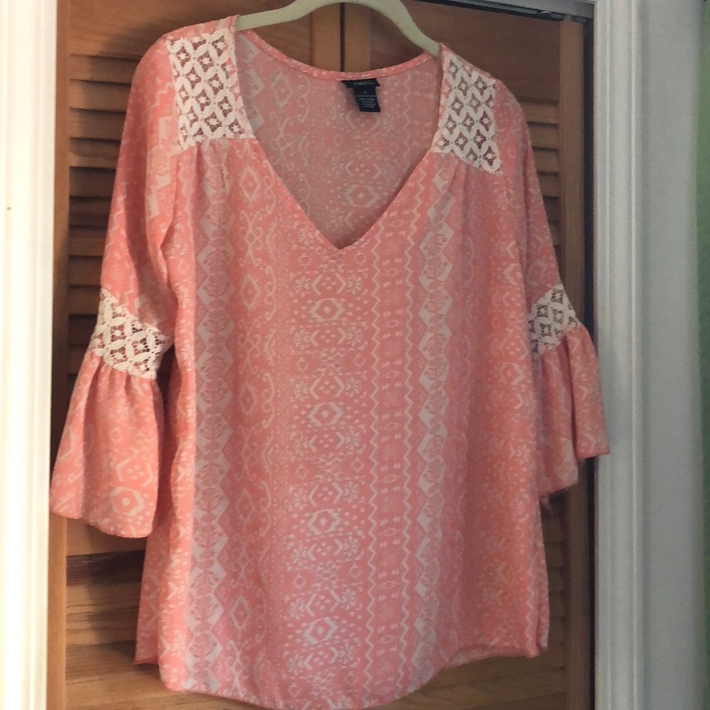 Very cute shirt with bell sleeves.